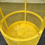Crane hoisting material basket. Inside view